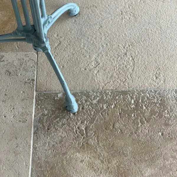 Antiqued French limestone flooring