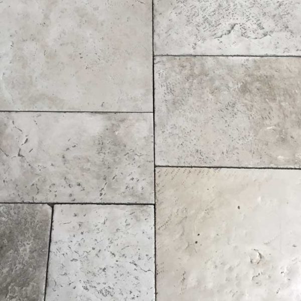 Distressed limestone flooring