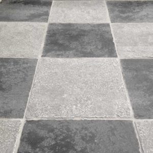 Black and grey chequered stone floor