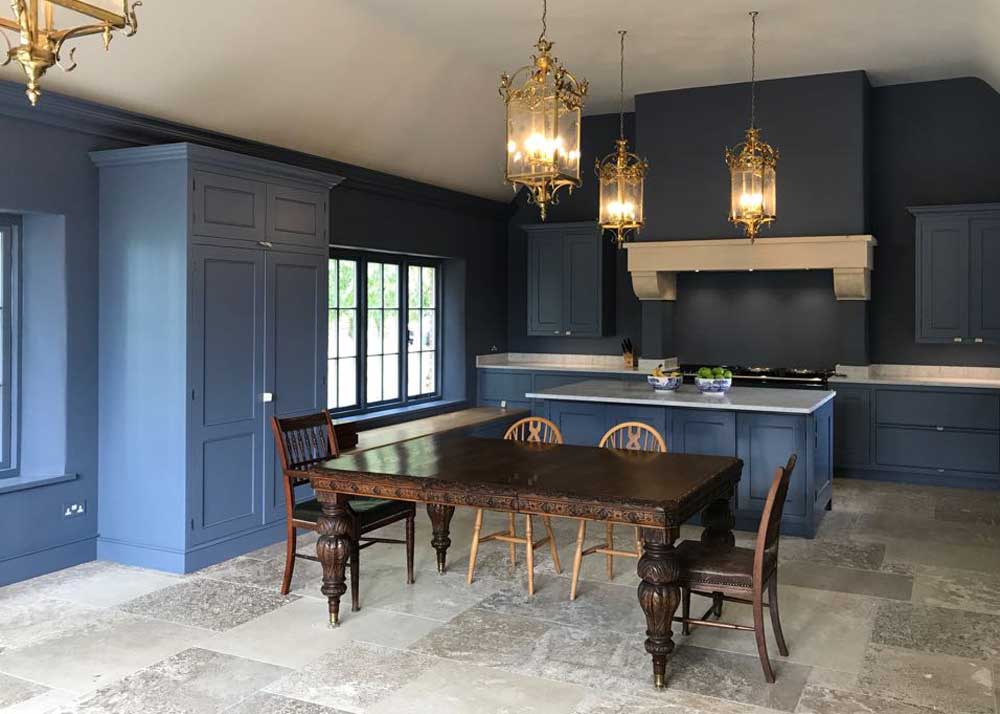 Navy-blue-kitchen-with-limestone-floor