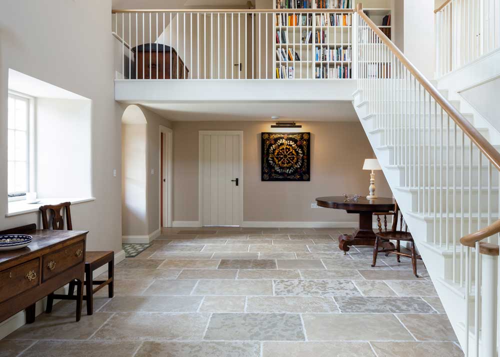 Hallway beige stone flooring