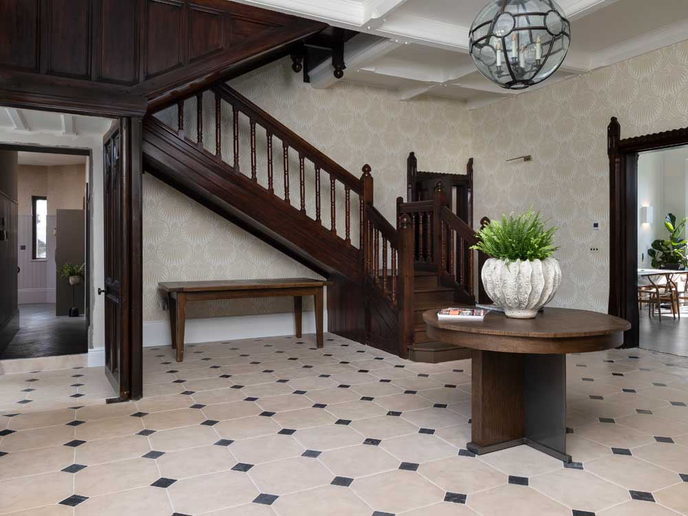 Antiqued limestone cabochon hallway flooring