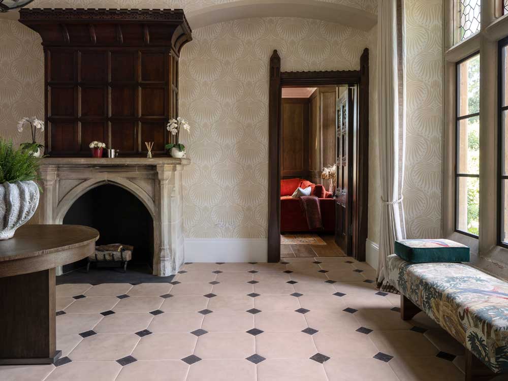 Antiqued limestone cabochon hallway flooring