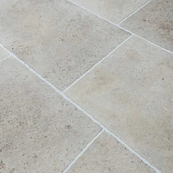 French white antiqued limestone floor