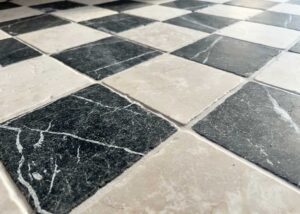 Black and cream tumbled marble floor tiles checkerboard